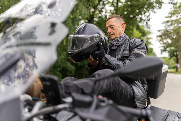 istock A man is setting safety helmet on the head 2217290341