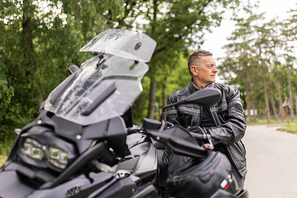 istock A man is sitting on his motorcycle and relaxing 2217290362