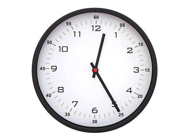 Simple round wall clock with black frame and white face, showing the time exactly at 00:25 or 12:25. Representing time precision in concepts of deadlines.