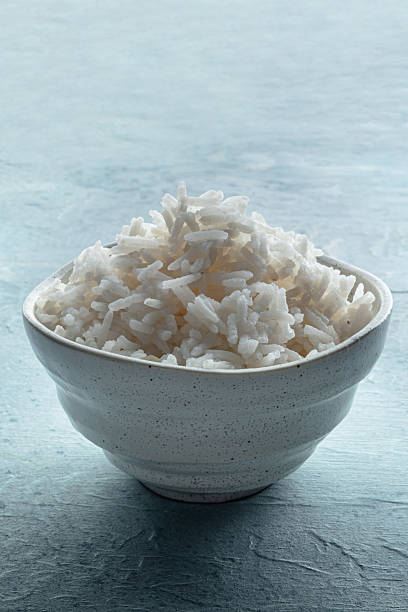 istock White rice, cooked. A bowl of boiled long grain rice, a simple side dish 2217293145