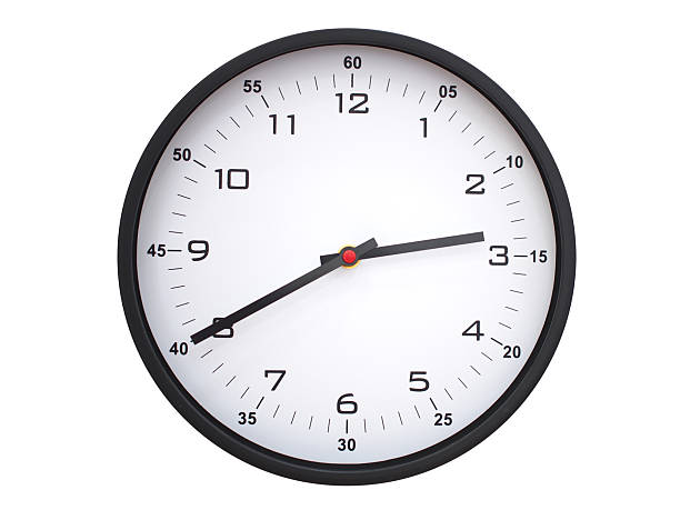 A modern white face with black numbers analog wall clock Showing 02:40 or 14:40. Isolated on White Background.A modern white face with black numbers analog wall clock Showing 02:40 or 14:40. Isolated on White Background.