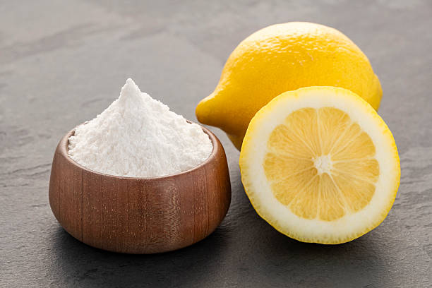 istock Yellow lemon fruit with baking soda in a bowl - Citrus Limon 2217295429