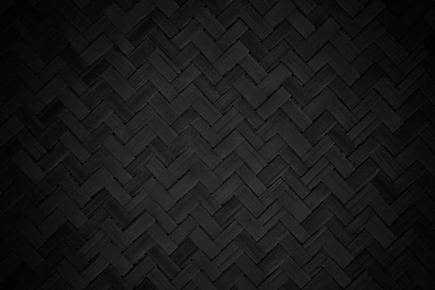 istock Old black bamboo weave texture background, pattern of woven rattan mat in vintage style. 2217296076