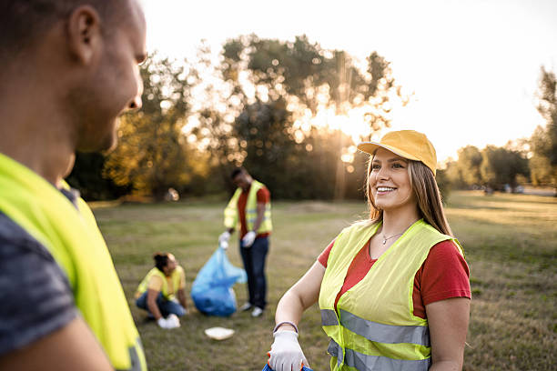 istock Volunteers collecting garbage in a public park during a cleanup event 2217297086
