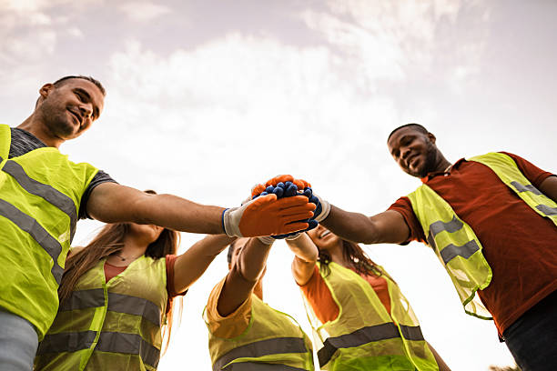 istock Volunteers joining hands for environmental protection and community support 2217297270