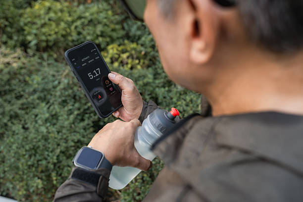 istock Senior Man Resting After a Run, Checking His Smartwatch and Activity tracker App on Smartphone 2217297462