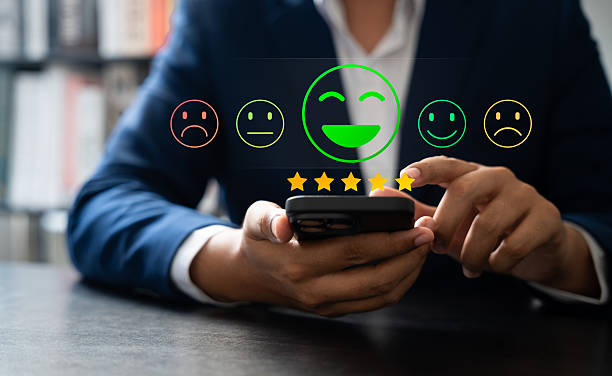 istock Customer using tablet give five star rating, Submit satisfaction survey through online application. Positive feedback highlight excellent service and product quality, improving brand reputation. 2217298058