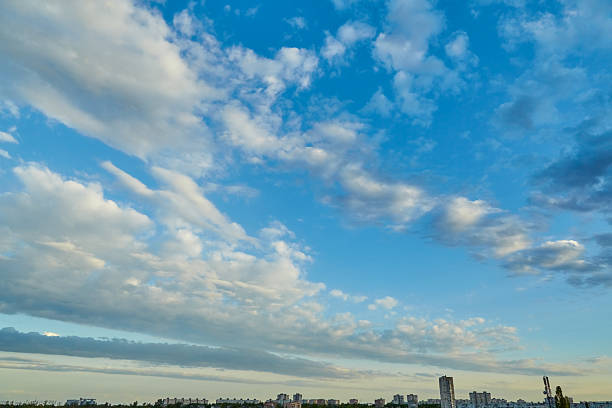 istock Cumulus clouds on the horizon: Calm white clouds stretching along the horizon create a sense of infinity for use in tourism materials. 2217298488