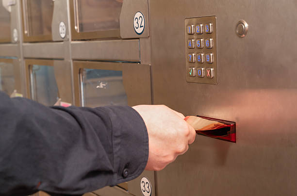 istock A person inserts a card into a machine labeled 32 2217299615