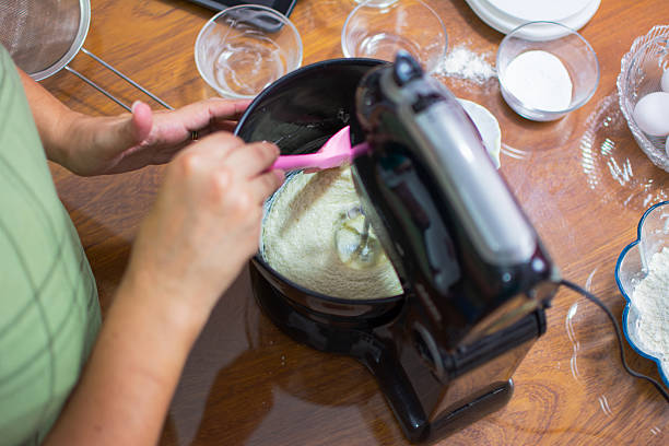 Woman selects ingredients to make dough, cake and pancakes.A delight made with love and care in the kitchen.
