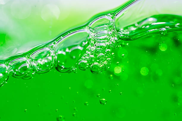 istock Water wave, close up of vibrant green liquid with bubbles, capturing dynamic movement and freshness. Perfect for backgrounds, beverages, or abstract concepts. soft drink 2217312446