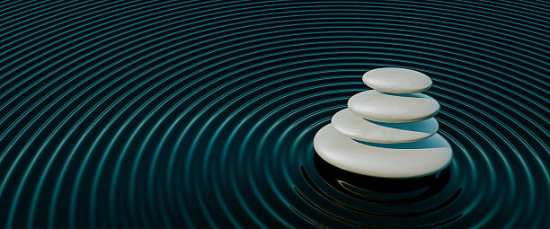 A serene and minimalist 3D render capturing the essence of tranquility and balance. A perfectly stacked cairn of smooth, black stones rests in a Japanese rock garden, with concentric circles raked into the surrounding sand. This powerful image symbolizes harmony, mindfulness, meditation, and stability. It is an ideal visual for wellness blogs, spa and health spa marketing, yoga studios, and any project related to relaxation, mental health, and finding inner peace. The simple yet profound composition evokes a sense of calm and focus.