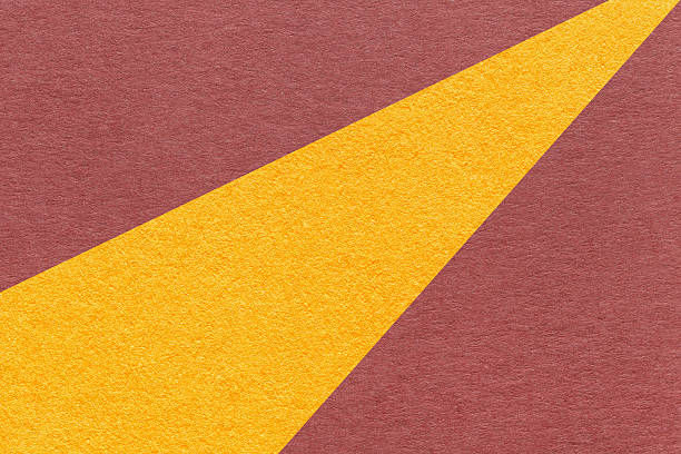 istock Abstract old geometric red paper background with yellow rays, macro texture for banner, template, presentation backdrop 2217317944