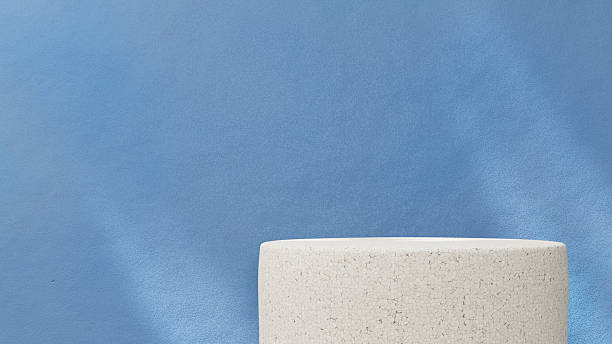 istock 3D rendered minimal scene featuring a white marble pedestal and cylinder podium on a pastel blue background. Ideal for product presentation, cosmetic display, or branding mockup with clean, modern aesthetics. 2217318848