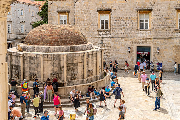 Dubrovnik, Croatia. 9 May 2025. People by Onofrio's Large Fountain in Dubrovnik