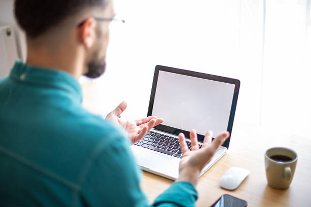istock Businessman gesturing during a video conference from home 2217323531