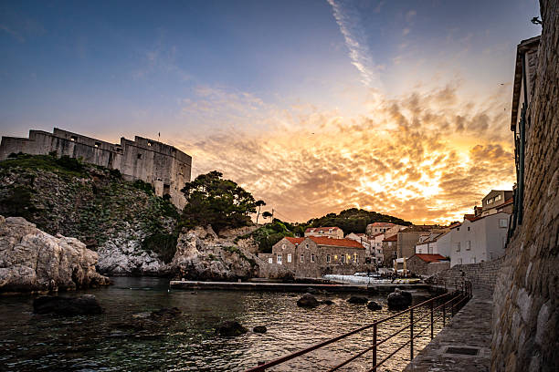 Sun sets over old town Dubrovnik coast