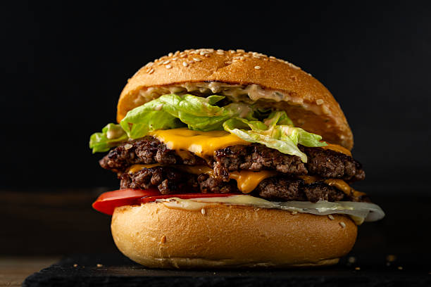 istock Close up of beef smach burger on dark surface 2217326741