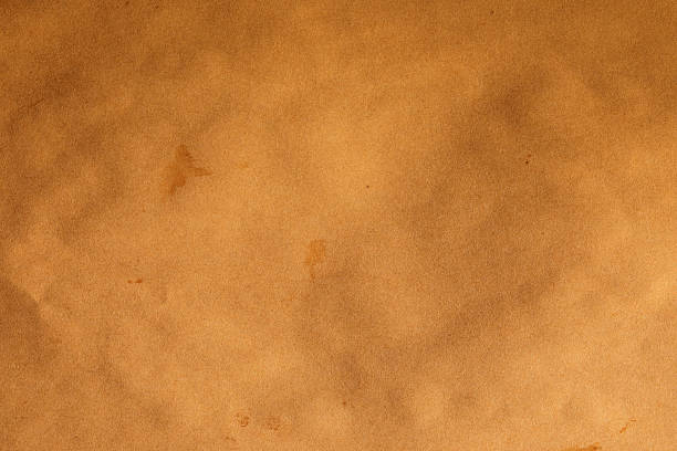 istock Crumpled, old aged paper background texture 2217327049