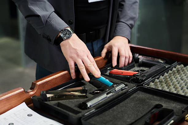 istock Inspecting and Handling Gun Parts on Workbench 2217328116