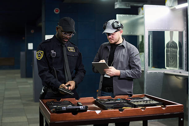 istock Examining Firearms and Equipment in Indoor Shooting Range 2217328139