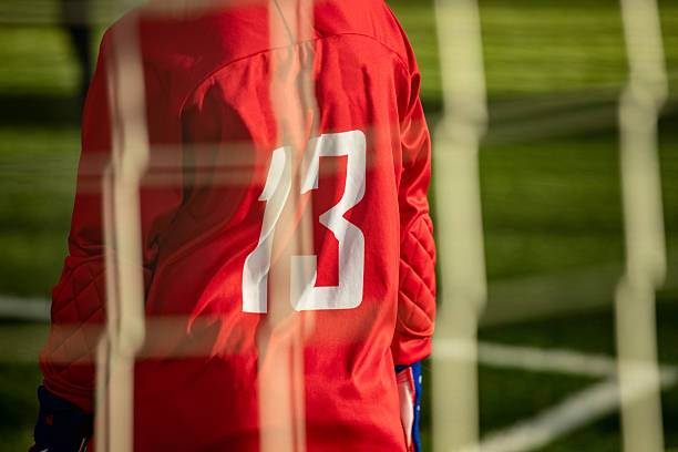 istock A young football player in a red uniform 2217328629