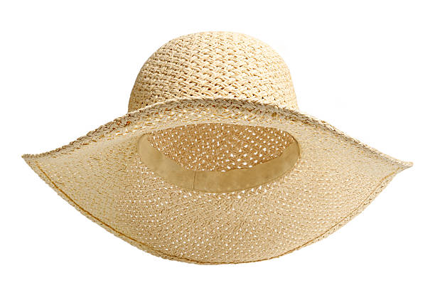 istock Beach straw hat front view and raised up isolated white background. Hat with clipping path as design banner, studio shot with sunlight. Summer travel hat for beach holidays on Vacation 2217329970