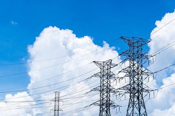 istock Three tall power lines are in the sky 2217330249
