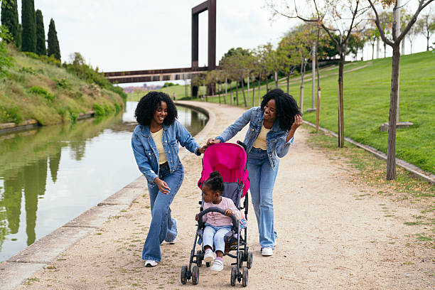 A group of mothers walk together with their babies in strollers along the peaceful path beside Tynemouth Boating Lake. Surrounded by calm water, open skies, and lush greenery, the scene captures a moment of connection, conversation, and shared joy. This regular meet-up offers a chance for fresh air, friendship, and a gentle pace—perfect for both mums and little ones.Videos are available similar to this scenario.