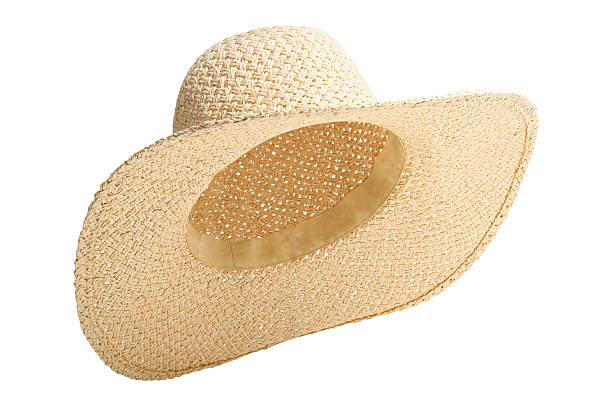 istock Straw beach hat three quarter turn to right and raised up isolated white background. Hat with clipping path as design banner, studio shot with sunlight. Summer travel hat for beach holidays on Vacation. 2217331027