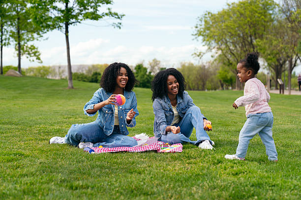 istock Twin sisters playing with their niece in the park 2217331882