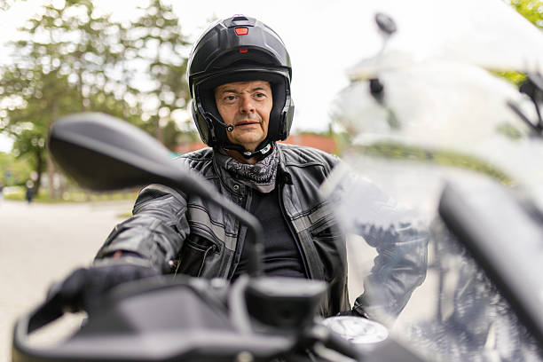 istock A man is sitting on his motorcycle on road 2217335874
