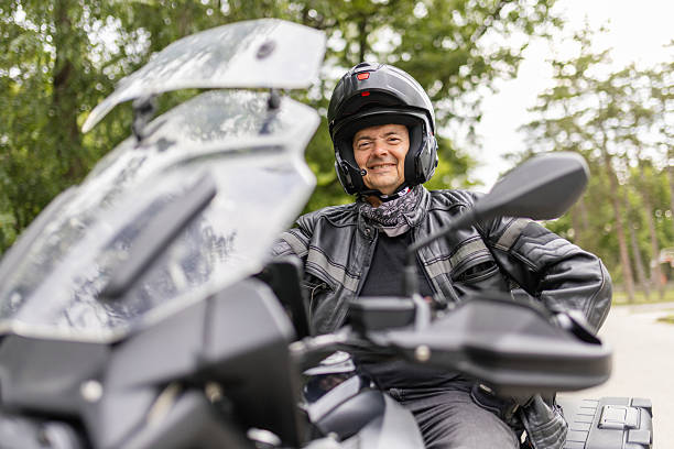 istock A man is sitting on his motorcycle on road 2217335876