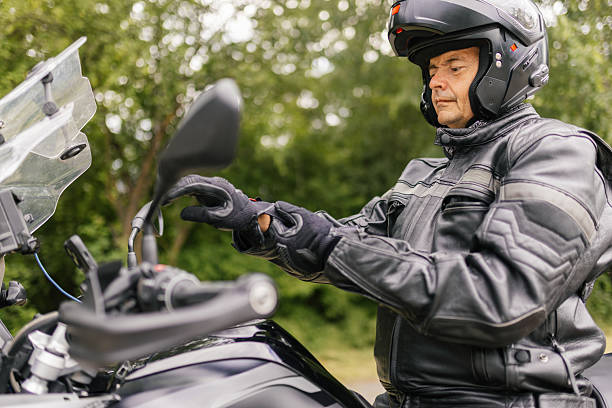 istock A man is setting safety gear before motorcycle ride 2217335957