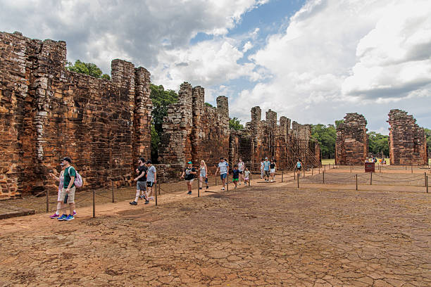 San Ignacio, Misiones, Argentina - May 5th, 2025: Tourists strolling through the ruins of San Ignacio.