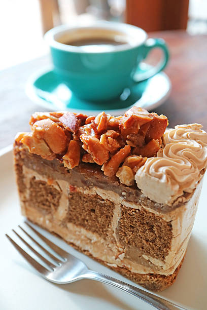 Macadamia cake with iced latte coffee on tray