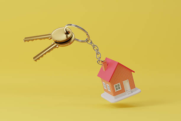 istock Toy house keychain isolated on yellow background. 3d illustration. 2217340439