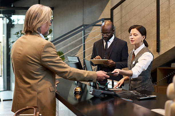 istock Conducting Business at Hotel Reception Desk 2217340733