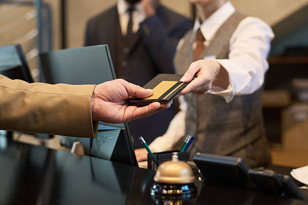 istock Handing Credit Card for Payment at Hotel Reception 2217340755