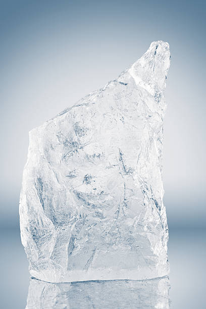 istock Crystal clear, pure rough ice block, on a white surface with reflection. Big piece of ice. 2217341380