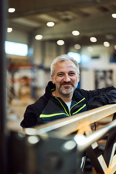 istock Confident Male Worker Posing in a Professional Industrial Workshop Setting 2217345104