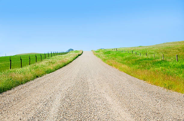 Canada Alberta, foothills farm road mid day