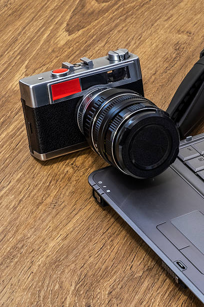 istock Vintage Camera and Laptop on Wood 2217346445
