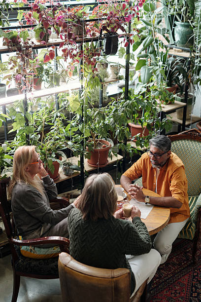 istock Discussing Gardening Tips Surrounded by Indoor Plants 2217348245