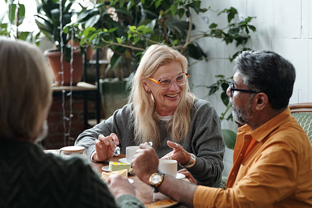 istock Smiling Seniors Sharing Coffee and Conversation 2217348322