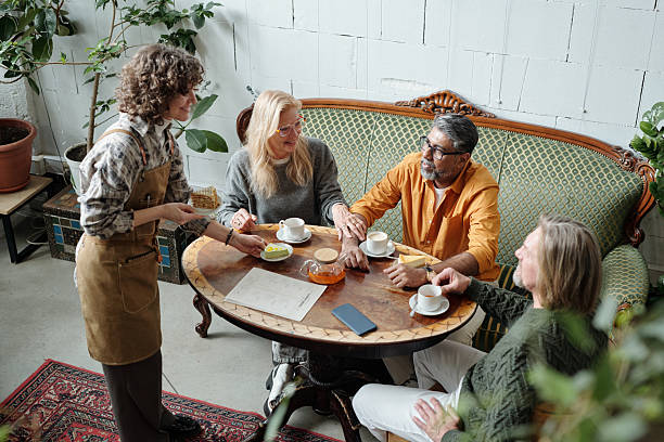 istock Enjoying Afternoon Tea in Cozy Cafe Setting with Friends 2217348329