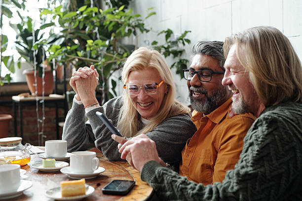 istock Sharing Laughter Over Coffee and Cake in a Cozy Cafe 2217348332