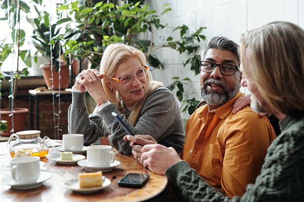 Discussing Ideas in Cozy Cafe with Coffee and Pastries