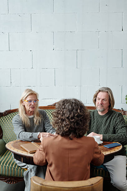 istock Discussing Business Proposal in Modern Coffee Shop 2217348343