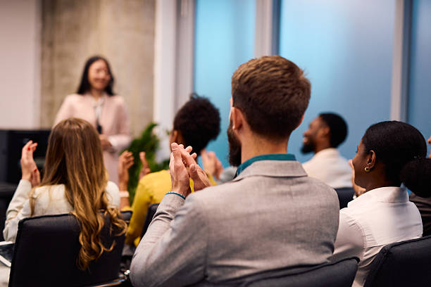 istock Business people clapping hands after a successful presentation in a conference room 2217360049